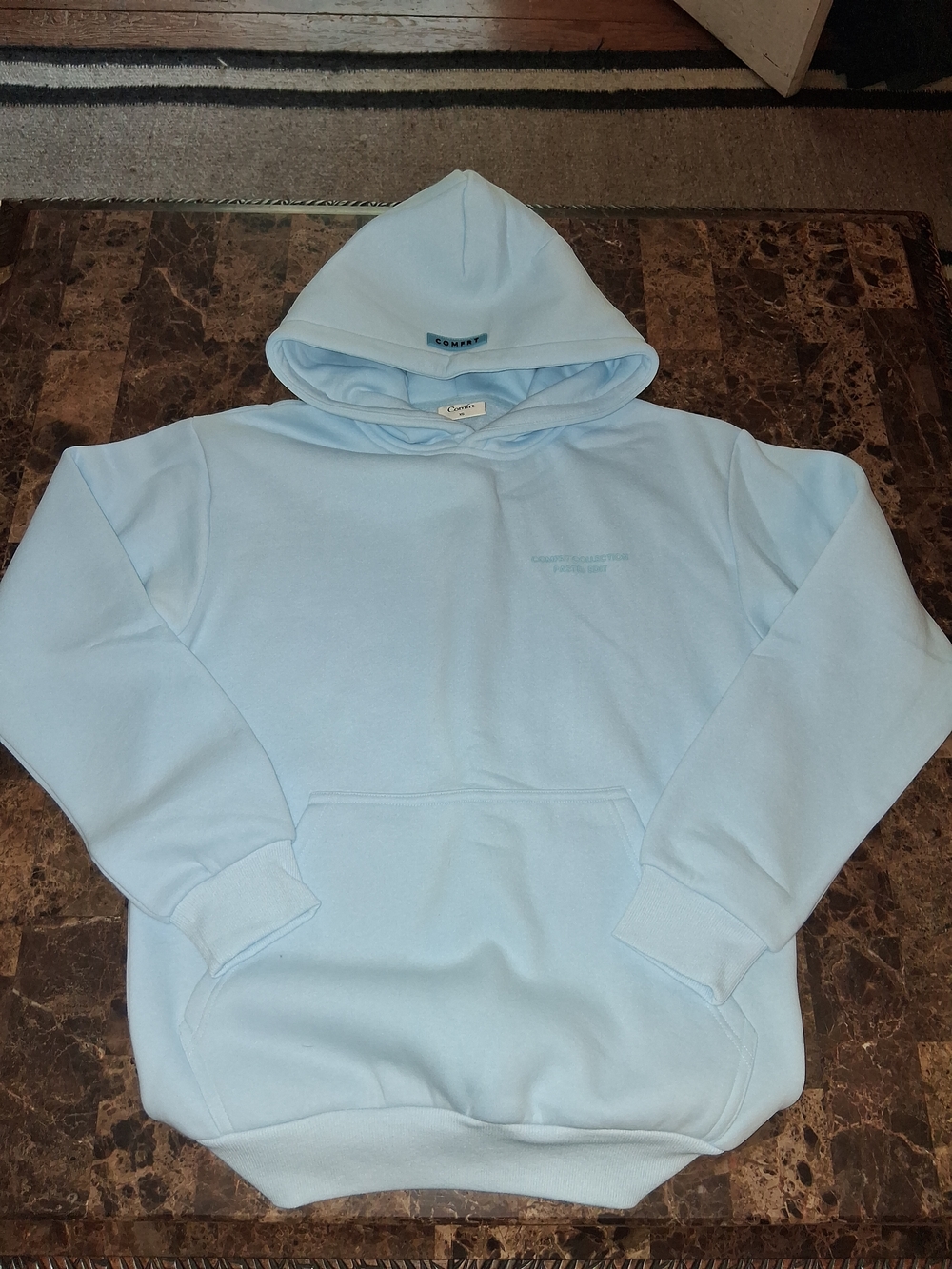Women's Light Blue Pullover Hoodie with Subtle Chest Logo